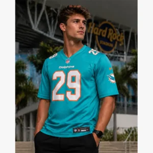 Male model wearing Storm Duck Miami Dolphins Aqua Jersey in front of Hard Rock Stadium.