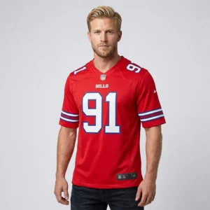 A male model wearing a red Buffalo Bills Ed Oliver #91 jersey with white and blue accents.